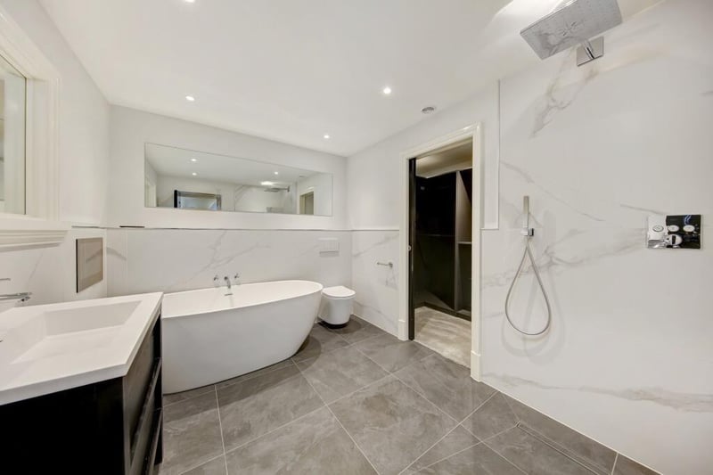 Watch television while you soak in the tub in the main penthouse's luxurious modern bathroom. This apartment is available at £1,500 per calendar month.