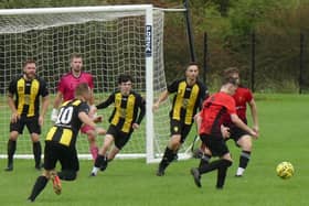 Action from the game between Hasland Community (in [yellow) against Grassmoor Reserves. Photos by Martin Roberts.