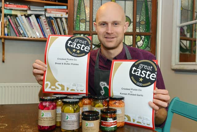 Felix Mendelsohn, founder of Chesterfield's 'Crooked Pickle', with his global Great Taste awards.