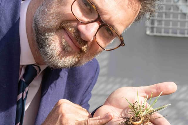 Charles Hanson with the ancient posy ring which raised £13,776 at auction.