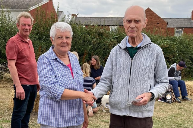 Bryon Edwards, running-up in the best kept allotment competition, is congratulated by Pam Hemsley, who chairs Grassmoor Hasland and Winsick Parish Council.
