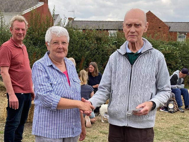 Bryon Edwards, running-up in the best kept allotment competition, is congratulated by Pam Hemsley, who chairs Grassmoor Hasland and Winsick Parish Council.