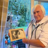 Mick Richmond with a photo of his wedding to Glennis, who spent her final days in Ashgate Hospice last December.