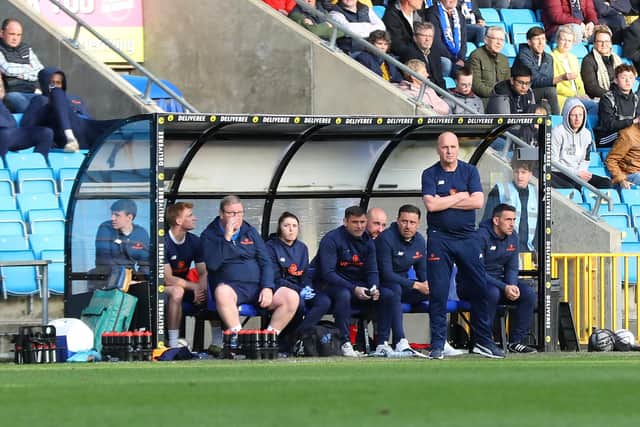 Paul Cook on the touchline at The Shay.