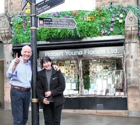 Robert and Carole Young outside their shop on Crown Square.