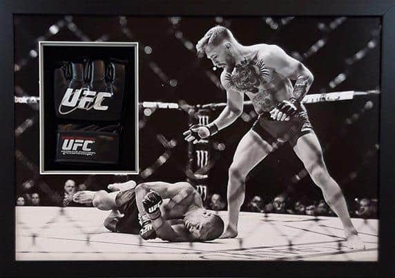 A mitt signed by UFC star Conor McGregor is among the items going under the hammer.