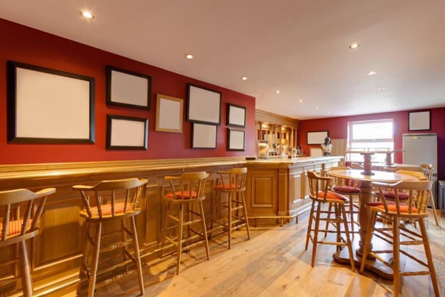 The Bar found in the garage building's first floor could easily be a home pub with all of the seating space and the size of the bar. It's perfect for entertaining and getting your friends over for a pint.