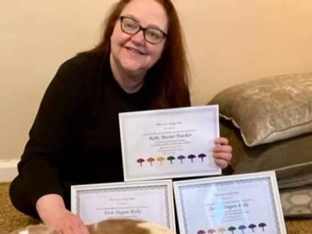 Nicala with her First Degree, Second Degree and Master Teacher Reiki certificates