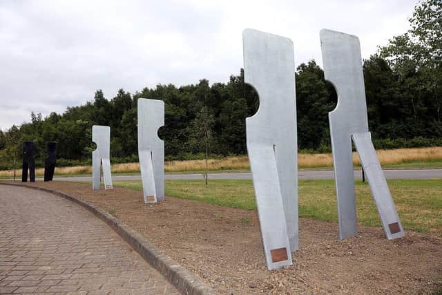 The memorial, pictured here in 2018, is made up of lighter metal figures walking in the direction of the pit and darker ones heading the opposite way. (Photo: Anne Shelley/Derbyshire Times)