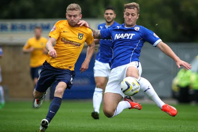 Liam Cooper's promotion with Leeds United will earn the Spireites around £150,000.