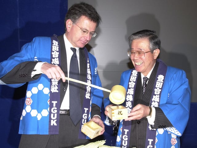 Pictured at the Toyoda Gosei UK Ldt works on Bessemer Way, Templeborough, Rotherham Seen is the Secretary of State for Trade and Industry Mr Stephen Byers as he pours sake from the barrel into the cup of Toyoda Gosei President Mr Tokio Horigome.