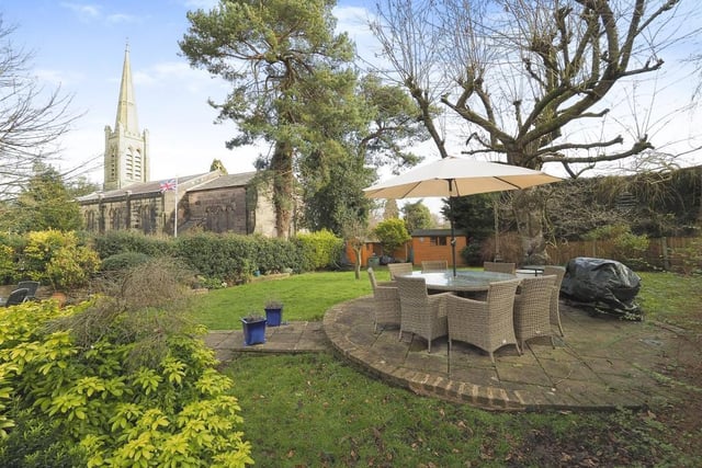 How gorgeous does this back garden look? Not just because of the views of St James's Church but also because of the circular patio area in the middle of the lawn. The shrubs and trees aren't bad either, are they?
