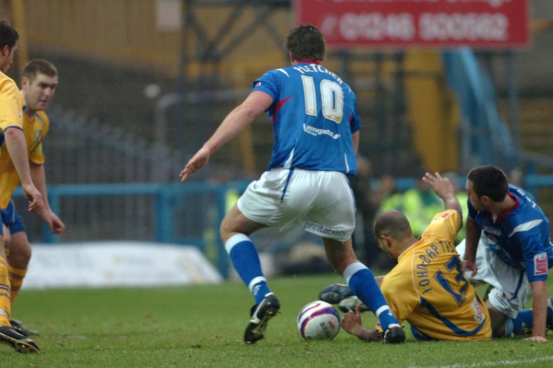 Steve Fletcher looks to pick up the loose ball following Alex Baptiste's tackle.