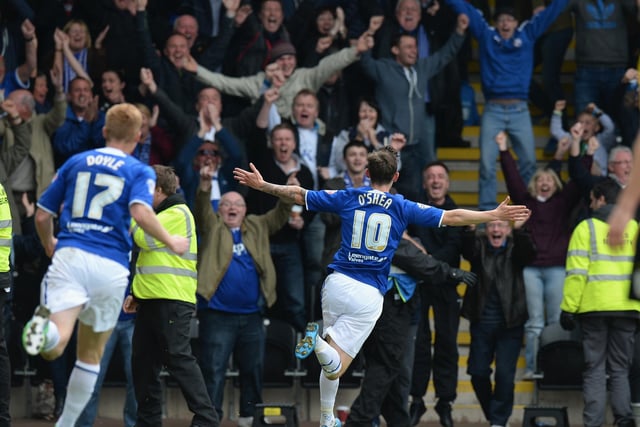 Jay O'Shea of Chesterfield celebrates to the fans after scoring their first goal during the Sky Bet League Two match between Burton Albion and Chesterfield.