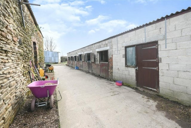 Fourteen stables, a tack room and menage are included in the sale of the property.