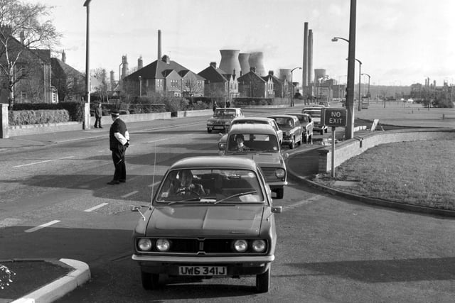 Cars queue as the first deliveries of Scottish North Sea oil and petrol from the Forties field arrive at a filling station in Grangemouth in November 1975.