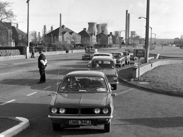 Cars queue as the first deliveries of Scottish North Sea oil and petrol from the Forties field arrive at a filling station in Grangemouth in November 1975.