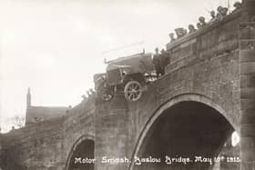 Baslow Bridge, 1915. A motor bus (Charabanc) accident, showing the bus balanced precariously over the parapet. Note that the vehicle has solid rubber tyres. The spectators are presumably the charabanc's passengers who have had a lucky escape. The stone bridge with cutwaters probably dates from the 17th century.  (Photo by NEMPR Picture the Past/Heritage Images/Getty Images)