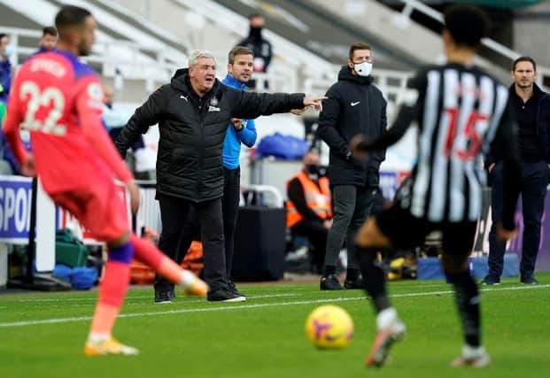 Newcastle United's English head coach Steve Bruce (2L) and Chelsea's English head coach Frank Lampard (R) watches his players from the touchline during the English Premier League football match between Newcastle United and Chelsea at St James' Park in Newcastle-upon-Tyne, north east England on November 21, 2020.