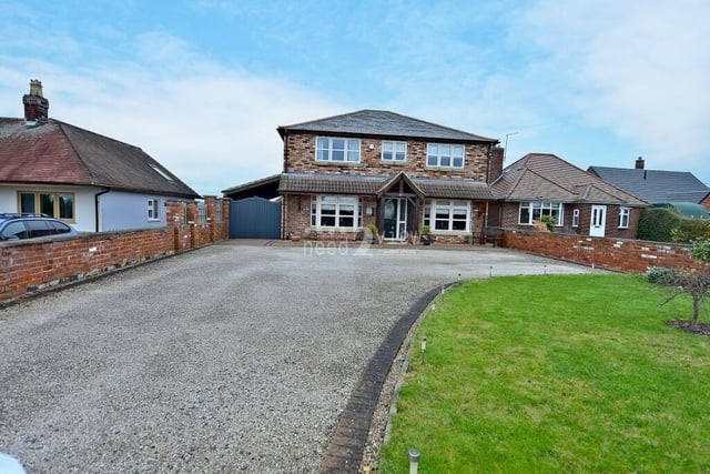 For the last photo in our gallery, we return to the front of the £575,000 Jacksdale property, where a lengthy driveway provides off-street parking space for multiple vehicles.