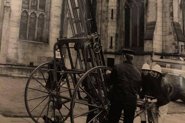 Firefighters moved a ladder in place outside Sheffield Cathedral after a fire broke out in 1979