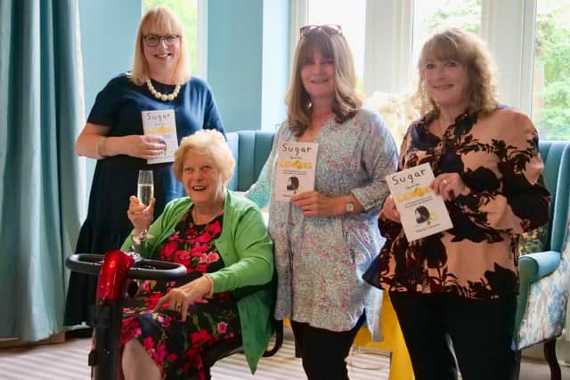 Author Maria Conyers, second left, at the book launch with representatives from Ashgate Hospice.