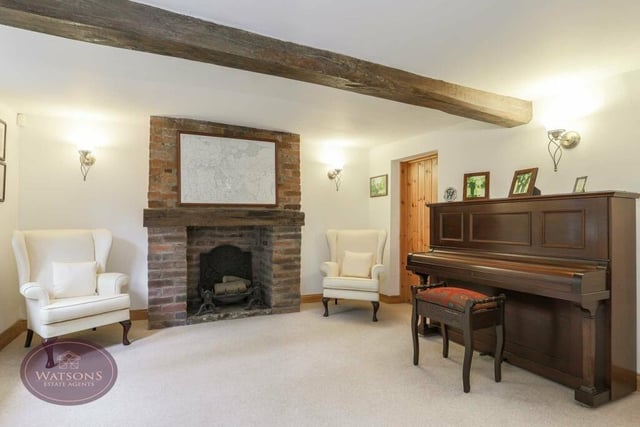 Next stop on our tour is this cosy sitting room, which also showcases exposed ceiling beams.