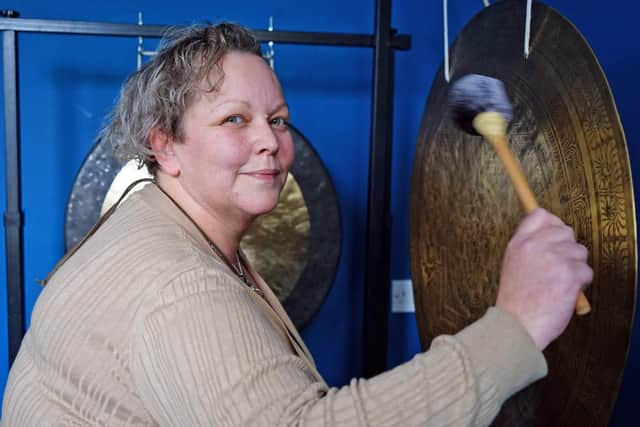 Kay McMenamin bangs the drum for gong baths