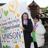 Unison's giant thank you card for school support workers. Pictured are Evie and Charlotte Allen along with Derbyshire branch secretary Jeanette Lloyd