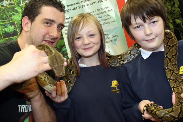 Tupton Hall School science and nature festival in 2008. Stephen Rowlands with his baby Python and pupils Lorna Pratt and Alex Orme.