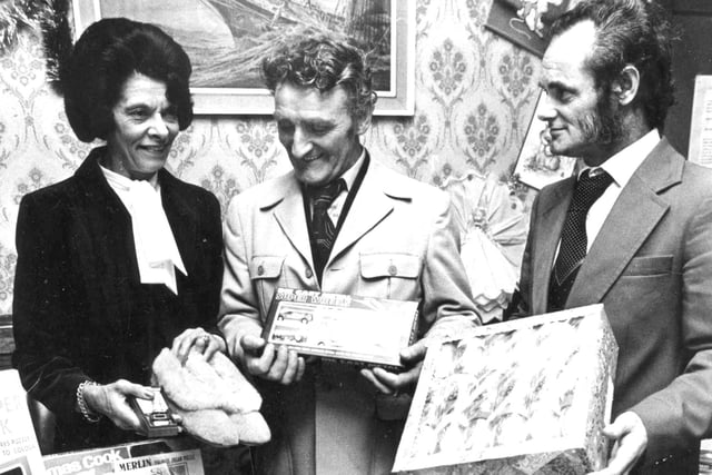 Violet Colley, manageress of the Satellite public house, with two of her regulars Albert Ord and Jim Carlyle. Customers raised more than £350 for their Christmas fund for children and old people in 1980.
