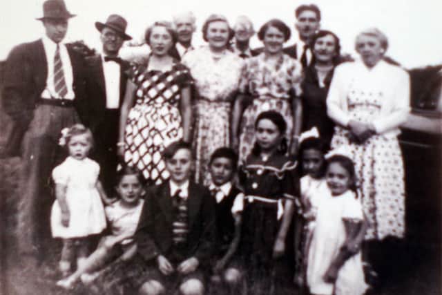 Ted, left, Arthur Fawbert, , Mary Waterfield, Cyril Beecroft, Agnes Beecroft, John Edward Trickett (Ted's father),  Ida Fawbert, Derek Waterfield, Joan Trickett (Ted's wife),  Lily Bennett; front row, Jane and Susan Waterfield, Michael Fawbert, John, Carol, Theresa, Denise Trickett (Ted and Joan's four children; their fifth daughter Juliet was born after this photo was taken).