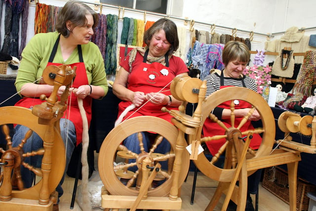 Caroline Simpson, Catherine Housley and Sharon Rowlands of The Three Spinners give a demonstration of their art at an exhibition of their work at Cromford Mill in 2009