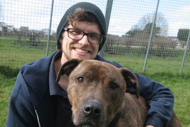 Chesterfield RSPCA long term resident Buster who is looking for his forever home (pictured with  with staff member Richard)