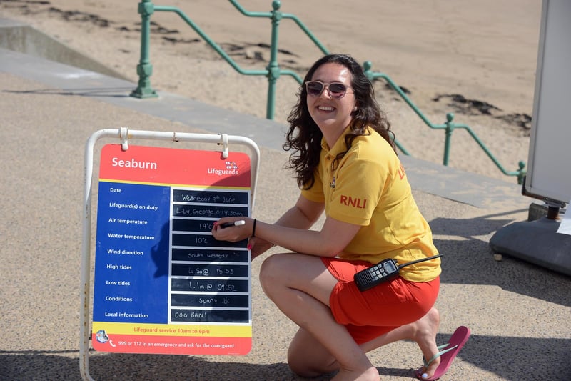 RNLI senior lifeguard Lily Humphries recording the temperature during the hot sunny weather at Seaburn Beach.