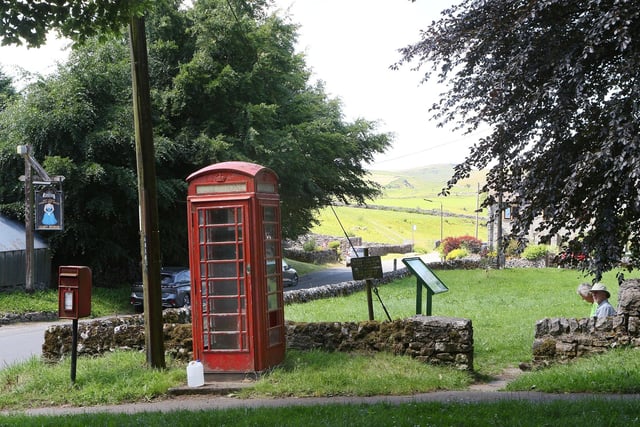 Earl Sterndale's telephone box is found across the road from the Quiet Woman pub. Telephone boxes like these are rare sights in most towns and cities in Britain today.