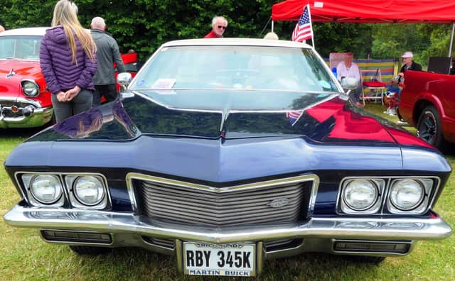 A Buick attracts interest from visitors to the American car show at Heage Windmill.