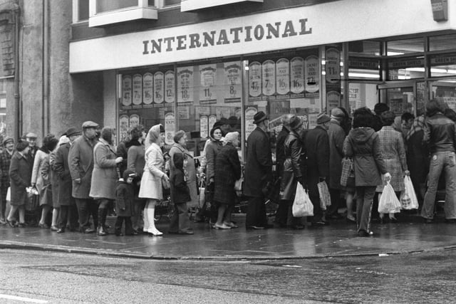 A bread queue in 1974 outside Buxton's International stores, the town's first supermarket. The national bakers' strike was part of the wave of disputes that affected many industries at the time.