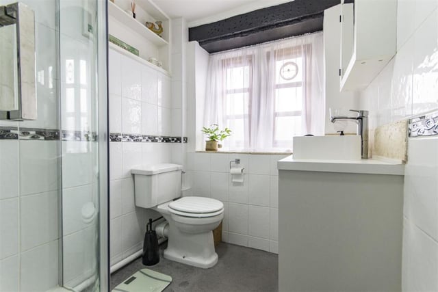 Fully tiled and fitted with a white suite, this room contains a shower cubicle with mixer shower, wash basin and wc.