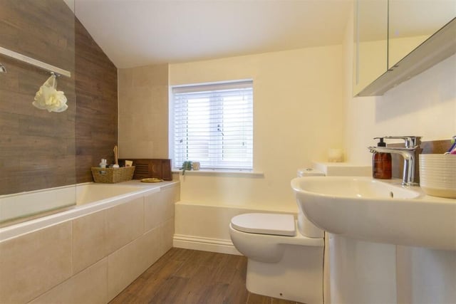 The family bathroom has a white three-piece suite with mixer shower over, wash basin and wc.