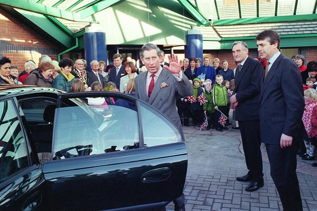 Prince Charles waves goodbye to the crowds gathered outside Chesterfield Royal Hospital.
