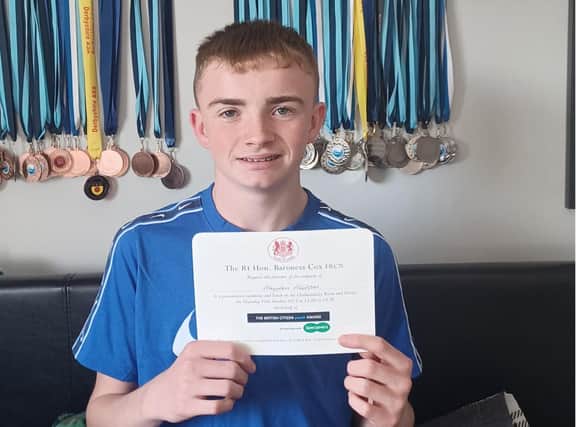 Hayden Hudson with his invitation to the British Citizen Youth Award presentation ceremony at the Palace of Westminster on October 12, 2023.