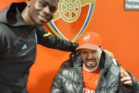 Neil, a resident at Yarningdale care home, Ripley, had his lifelong wish granted when he had the opportunity to watch his favourite football club Arsenal play in the Premier League. Pictured is Neil and Bukayo Saka.