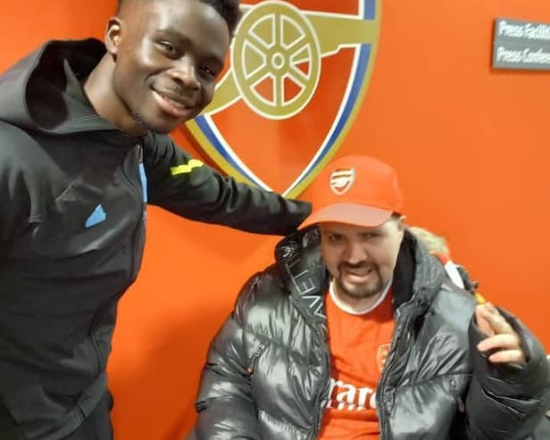 Neil, a resident at Yarningdale care home, Ripley, had his lifelong wish granted when he had the opportunity to watch his favourite football club Arsenal play in the Premier League. Pictured is Neil and Bukayo Saka.