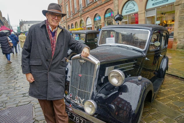 Mike Bevan is standing next to a 1937 Wolseley.