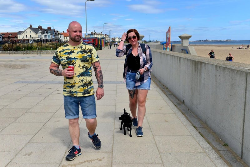 Douglas out walking at Seaton Carew with owners Chris and Charmain Baker.