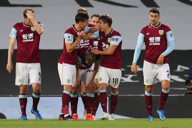 Burnley celebrate Ashley Westwood's opener in their 2-0 win over Fulham in May.