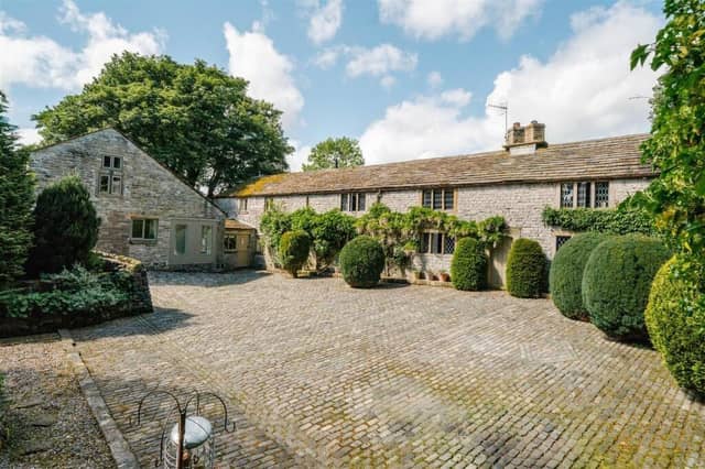 A farmhouse and two holiday let cottages are set within 5.25 acres of private grounds.