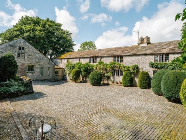 A farmhouse and two holiday let cottages are set within 5.25 acres of private grounds.