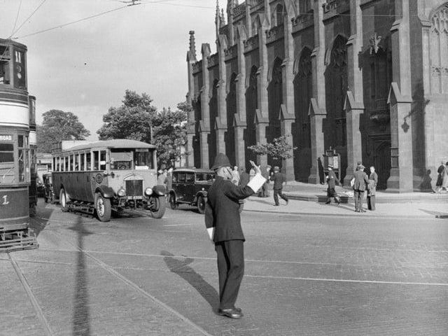 Policeman on points duty, West End.